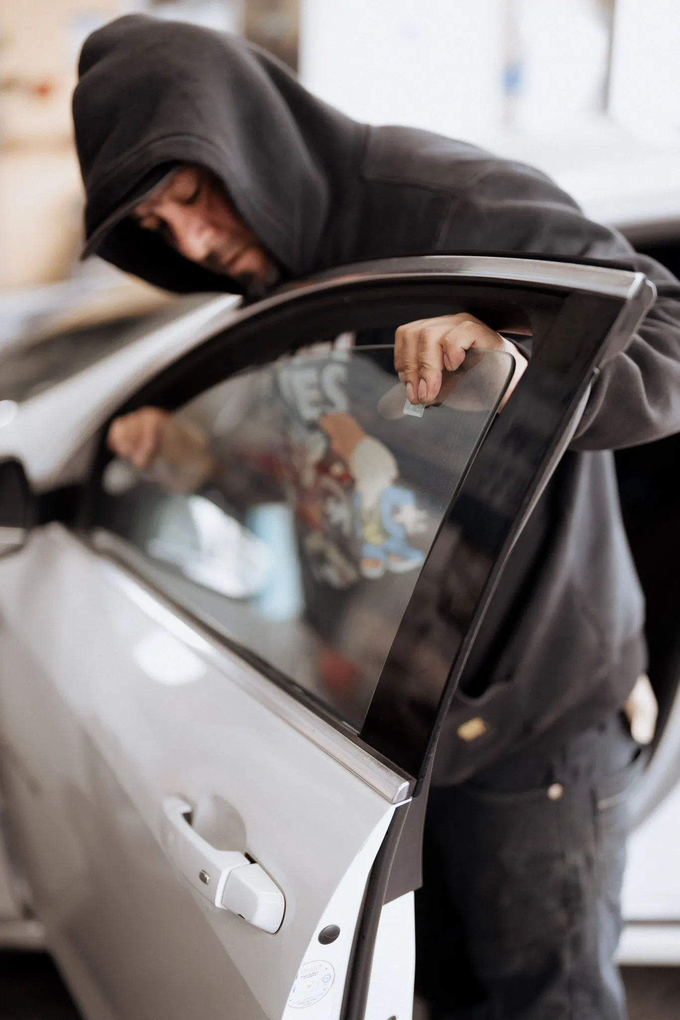 Technician installing new windshield
